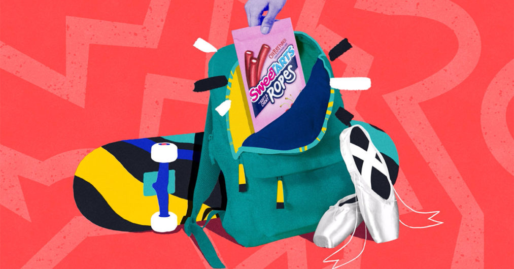An energetic graphic design centers a bag of SweeTARTS candy. The background of the design is red with a lighter red lightning bolt. In the center of the image is a skateboard, ballet slippers, and a bookbag. The book bag is open and the SweeTARTS candy sits in the bag.