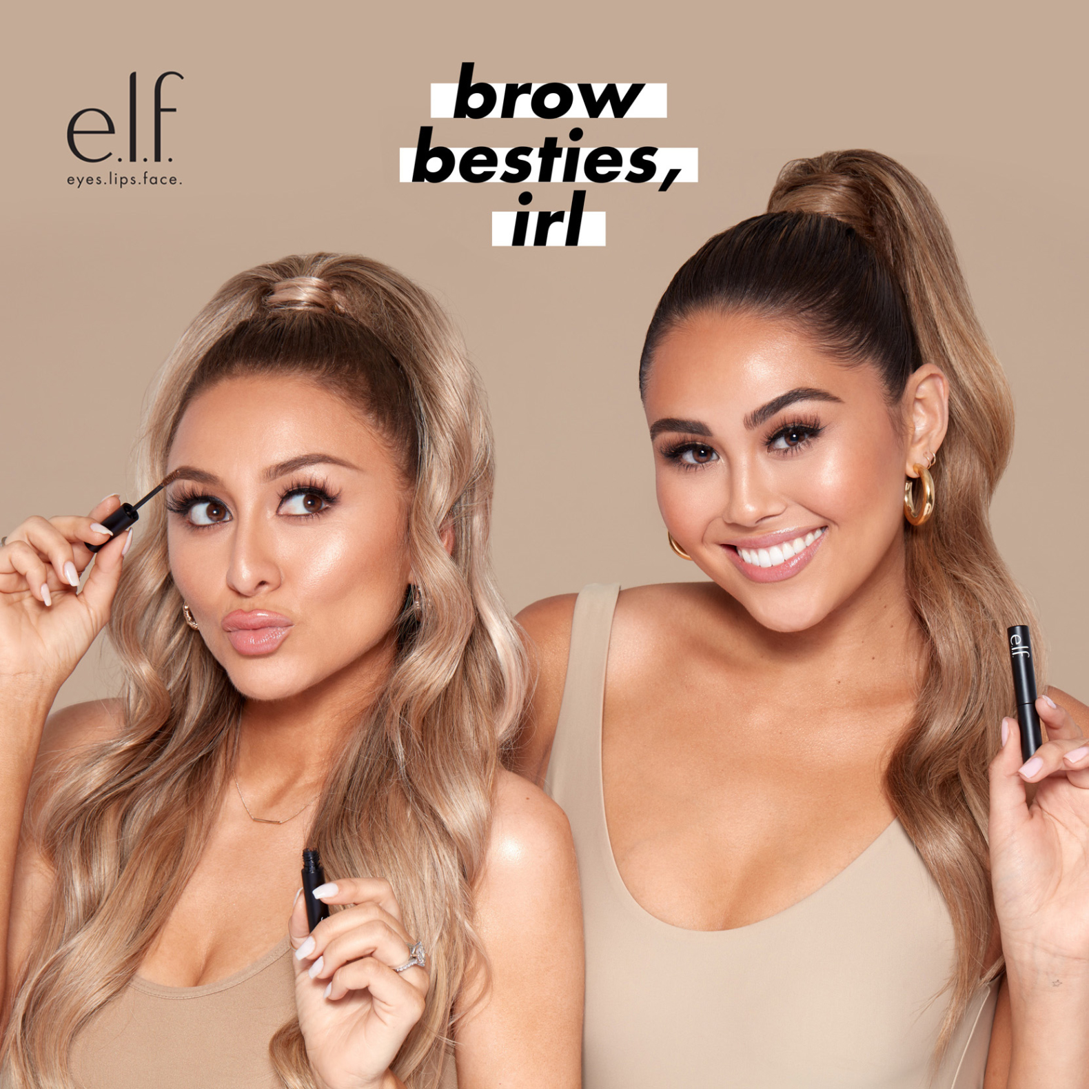 Two smiling people wearing makeup with long ponytails and matching tan tank tops holding eyebrow makeup products from e.l.f. The e.l.f. logo appears in the left corner and the words "brow besties, irl" are in the center on a white background.